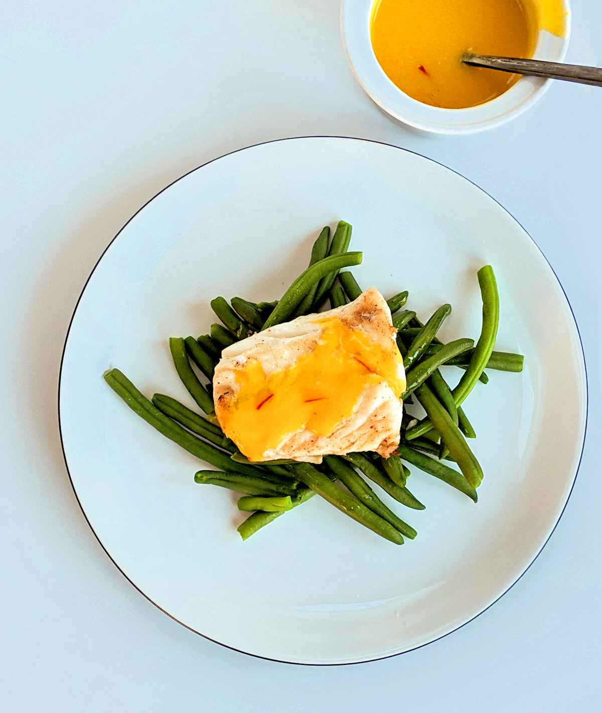 slow roasted haddock with saffron sauce cuisinefiend.com